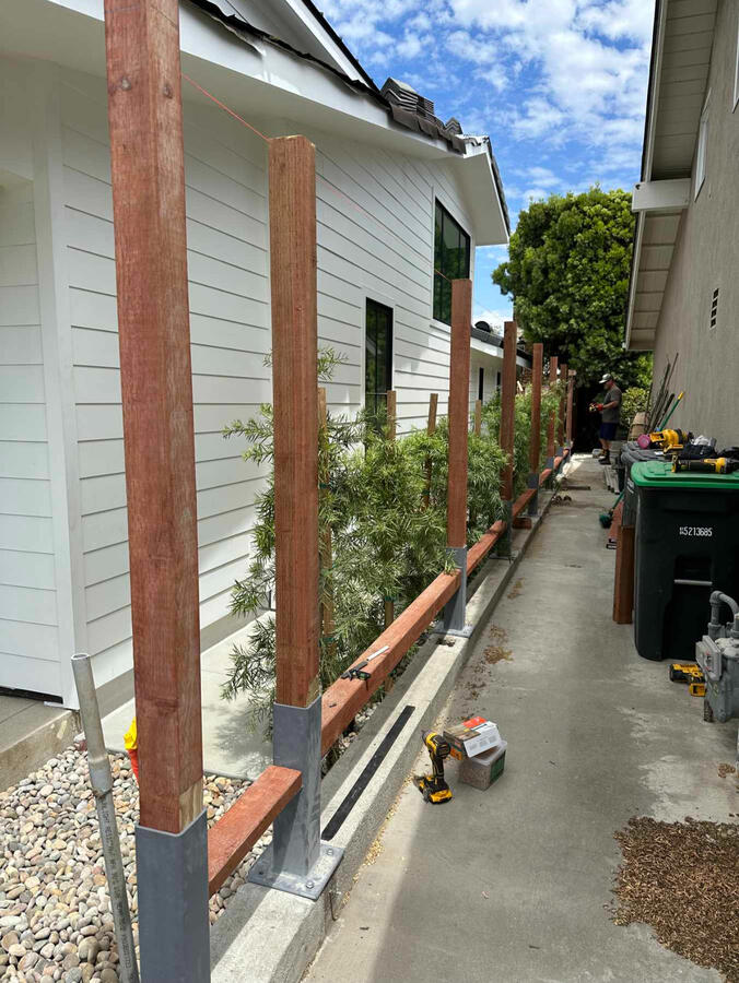 Fence with custom base and bracket
